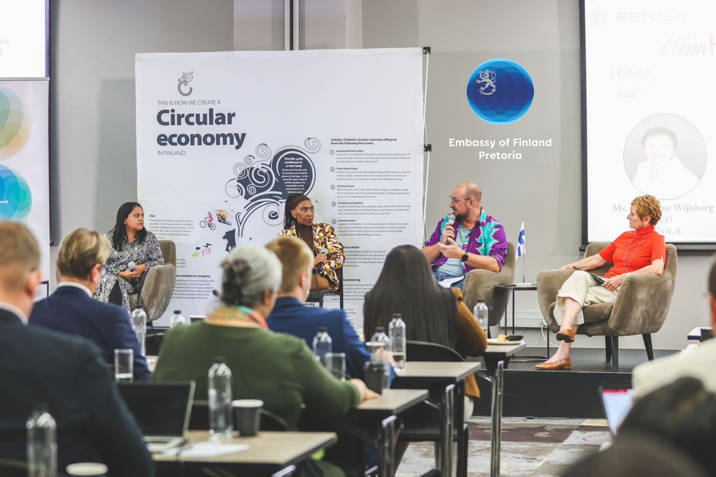 Panel discussion at the Circular Economy Dialogue 2026 with Embassy of Finland Pretoria signage in background