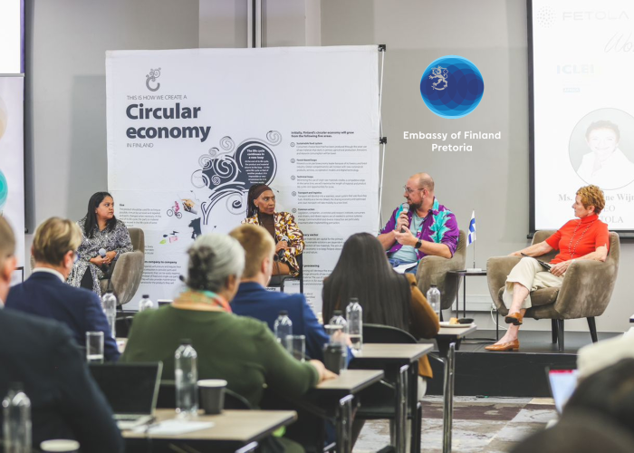 Panel discussion at the Circular Economy Dialogue 2026 with Embassy of Finland Pretoria signage in background