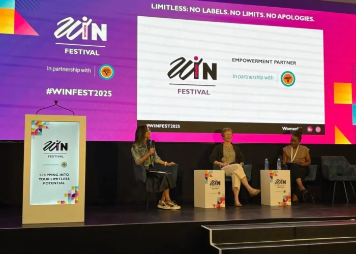 Catherine Wijnberg speaking during a fireside chat on stage at FNB WomenIn Festival 2025